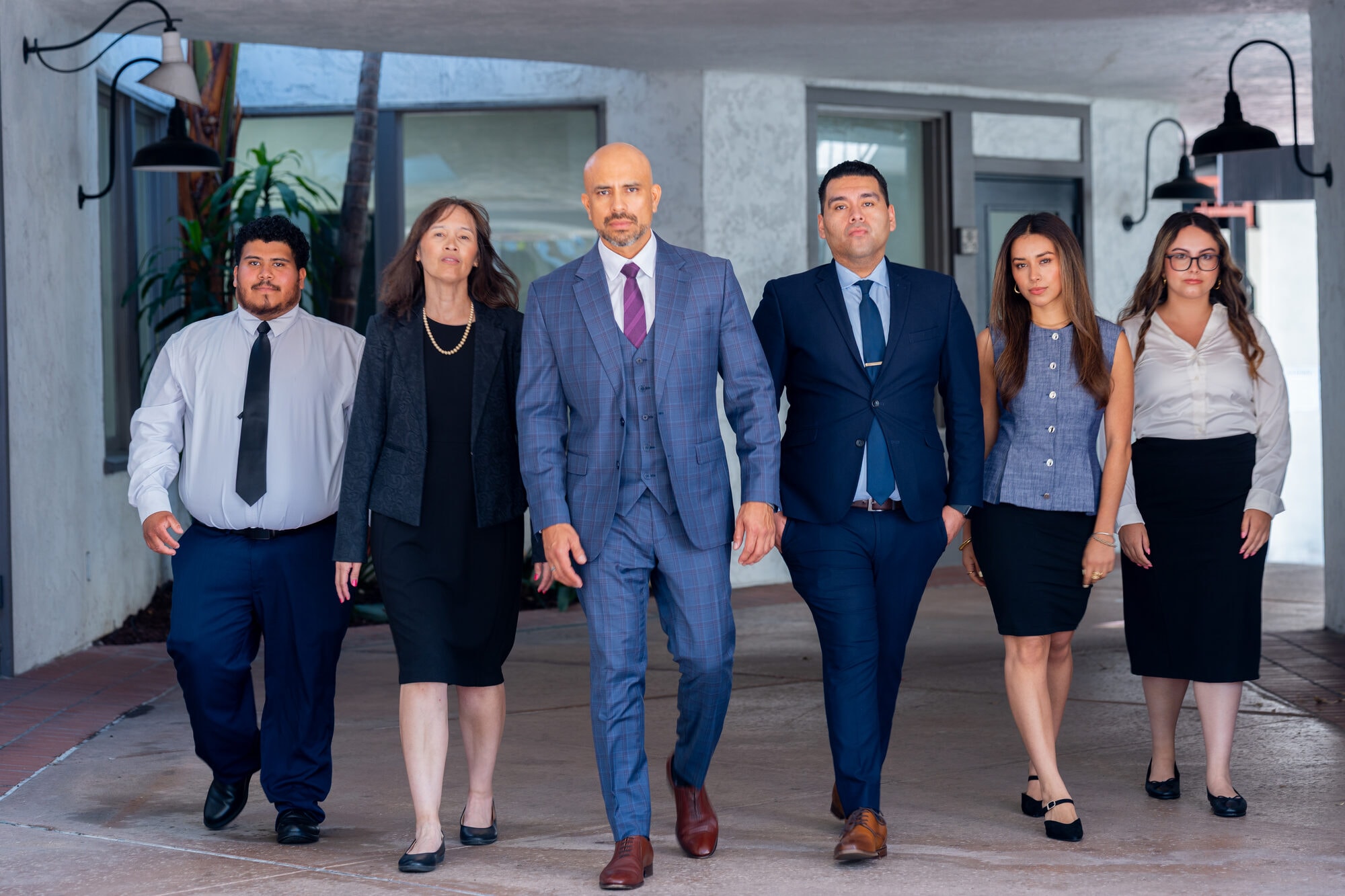 Orozco Law Firm legal team walking through their office corridor