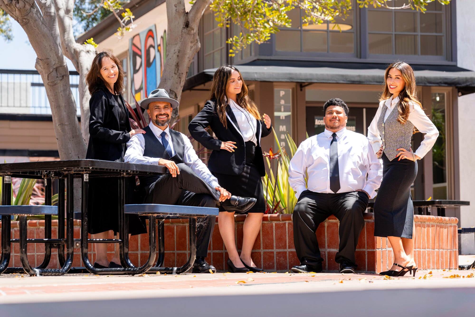 Orozco Law Firm team seated near their Third Avenue office in Chula Vista